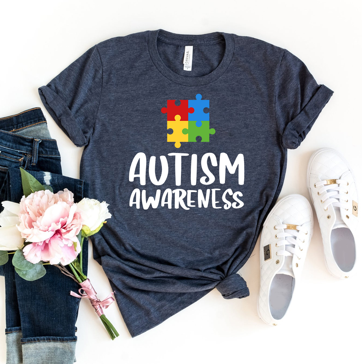 A stylish Autism Awareness T-shirt made from premium ring spun cotton, featuring a vibrant design promoting autism awareness.