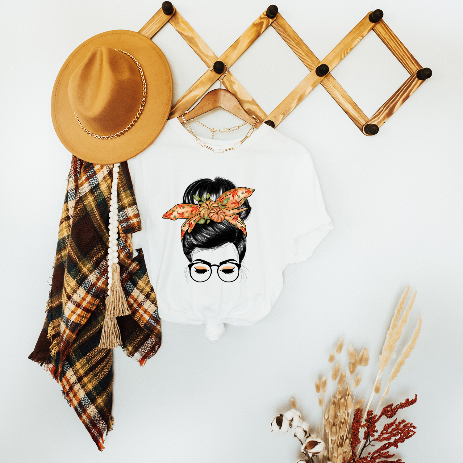 Autumn Bandana Messy Bun Unisex T-shirt featuring a stylish graphic design, perfect for fall fashion.