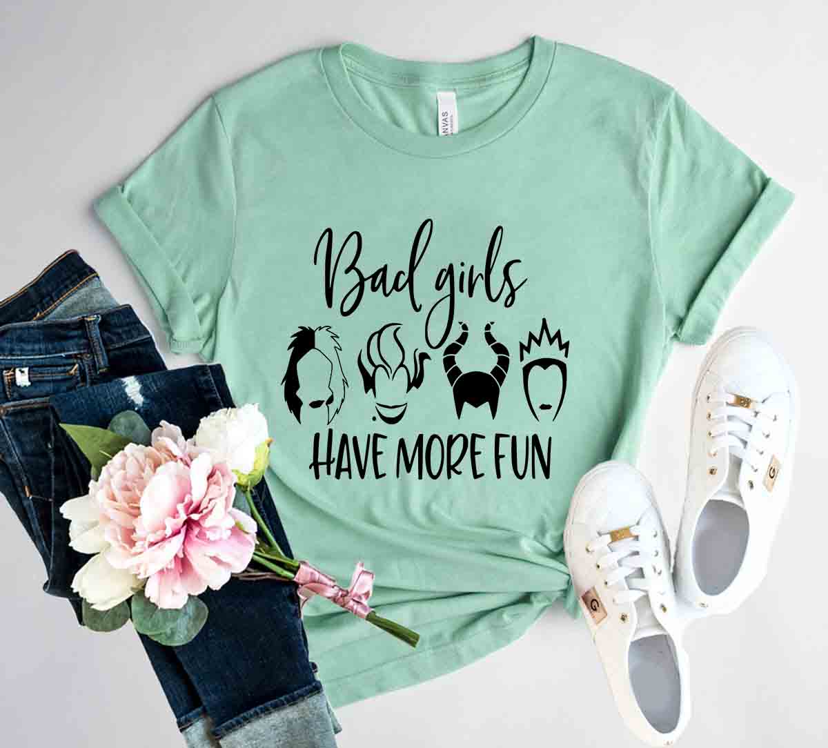 A stylish unisex T-shirt featuring the phrase 'Bad Girls Have More Fun' in bold print, made from soft ring spun cotton, available in various colors.