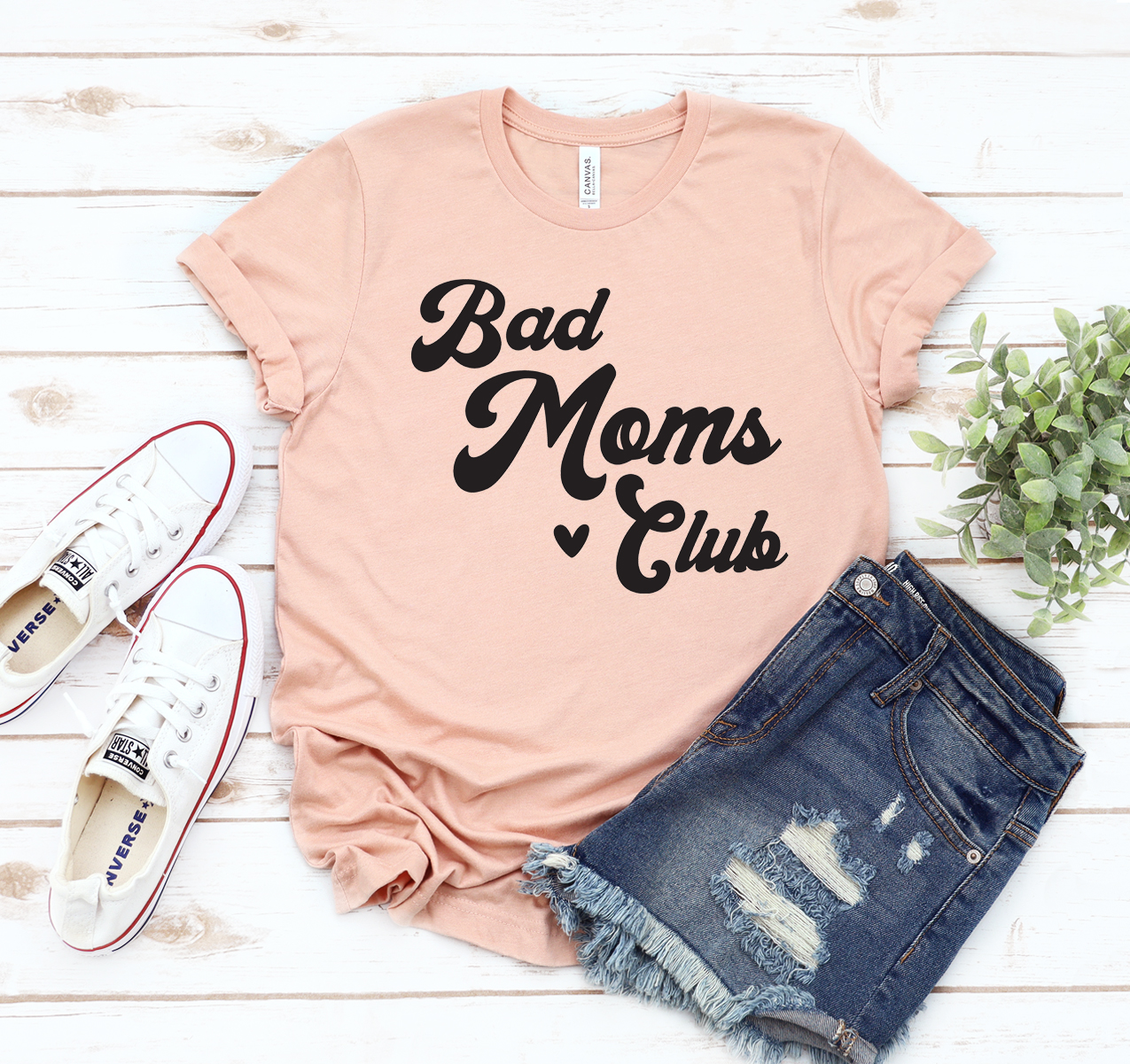 Bad Moms Club T-shirt in various sizes, showcasing its soft fabric and stylish design.