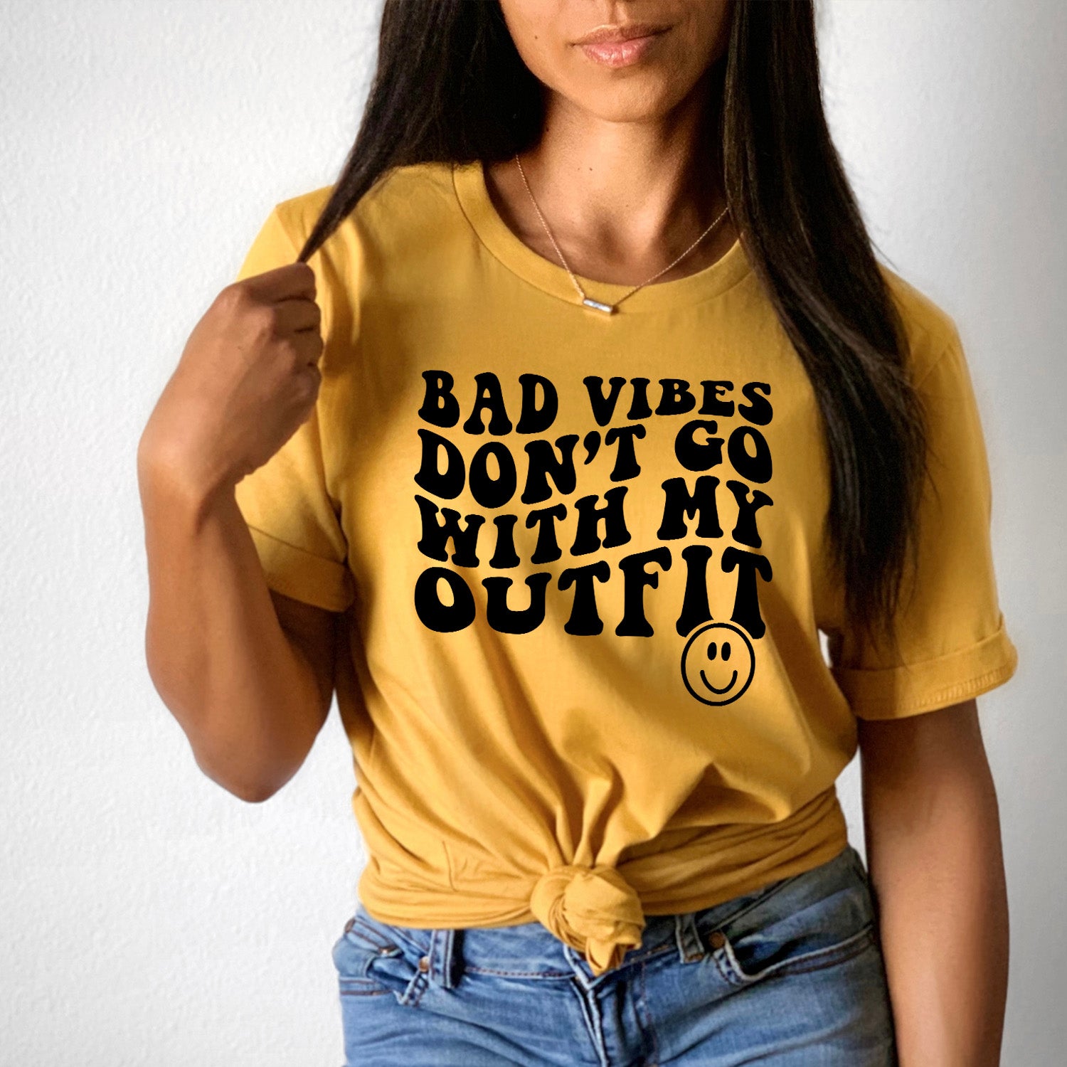 Bad Vibes Outfit Smiley Face Unisex T-shirt featuring a vibrant smiley face graphic on a soft fabric.