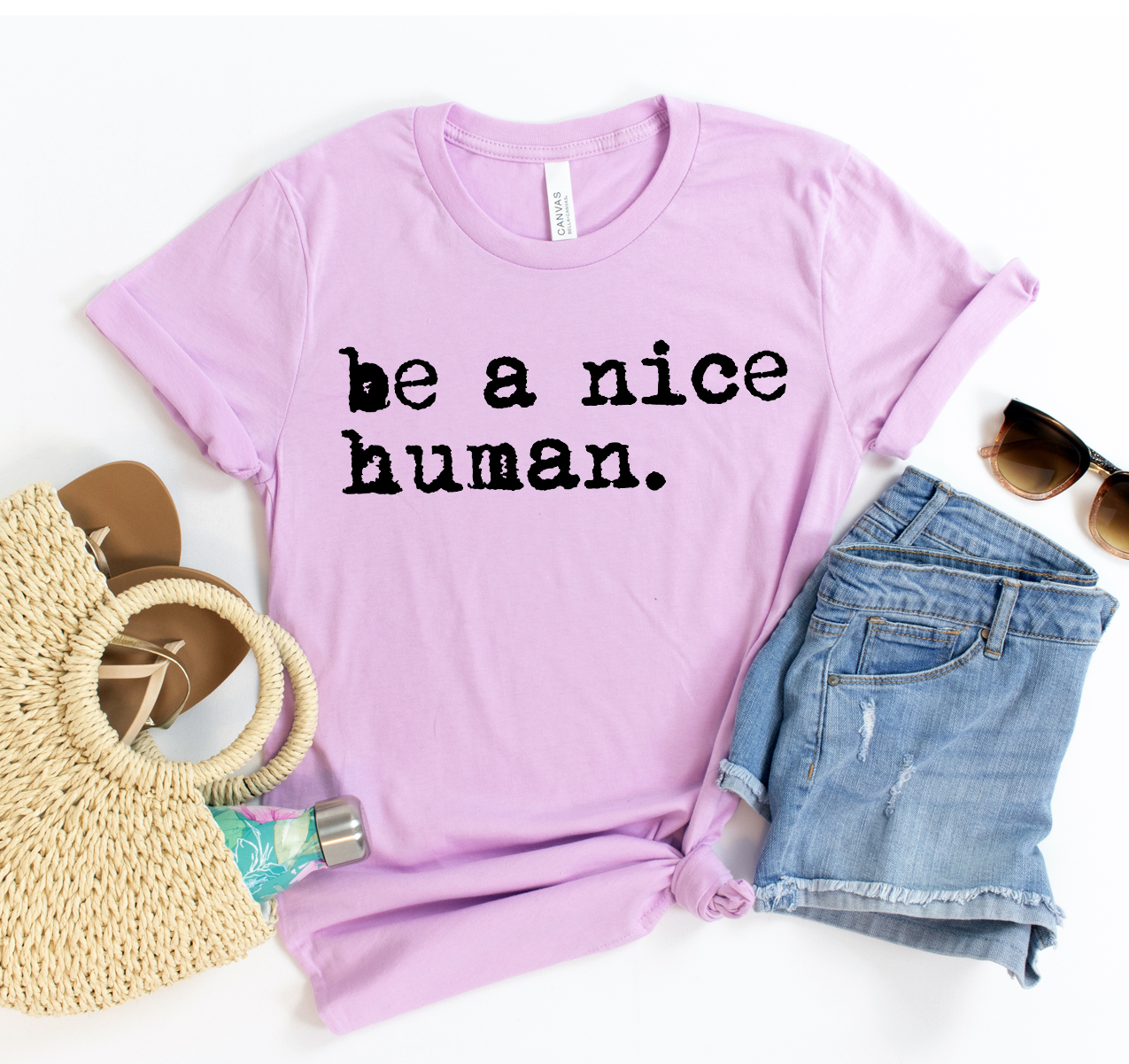 Be A Nice Human T-shirt displayed on a mannequin, showcasing its unisex design and soft fabric.