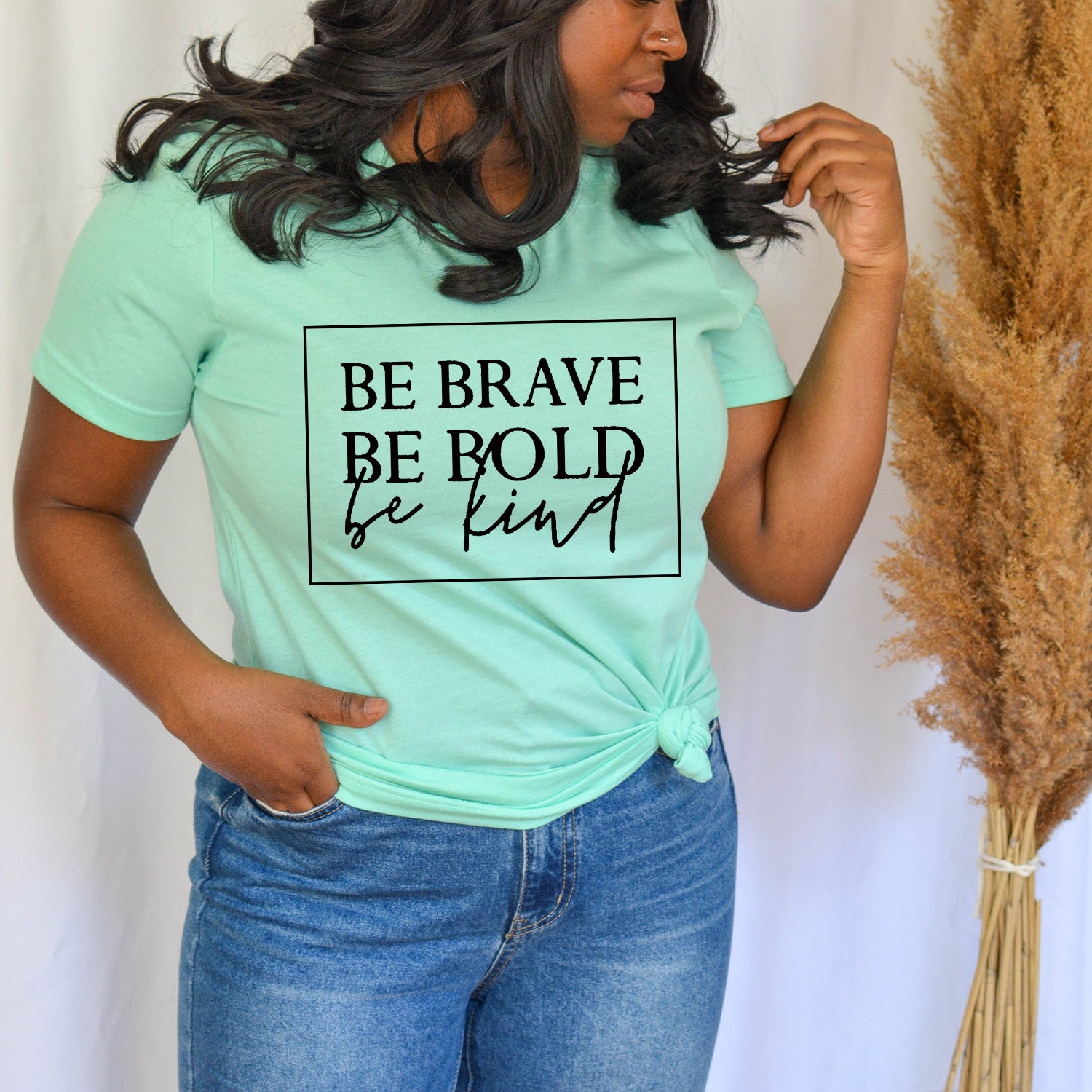 Be Bold Be Brave Be Kind Unisex T-shirt featuring a vibrant graphic design on a soft fabric.