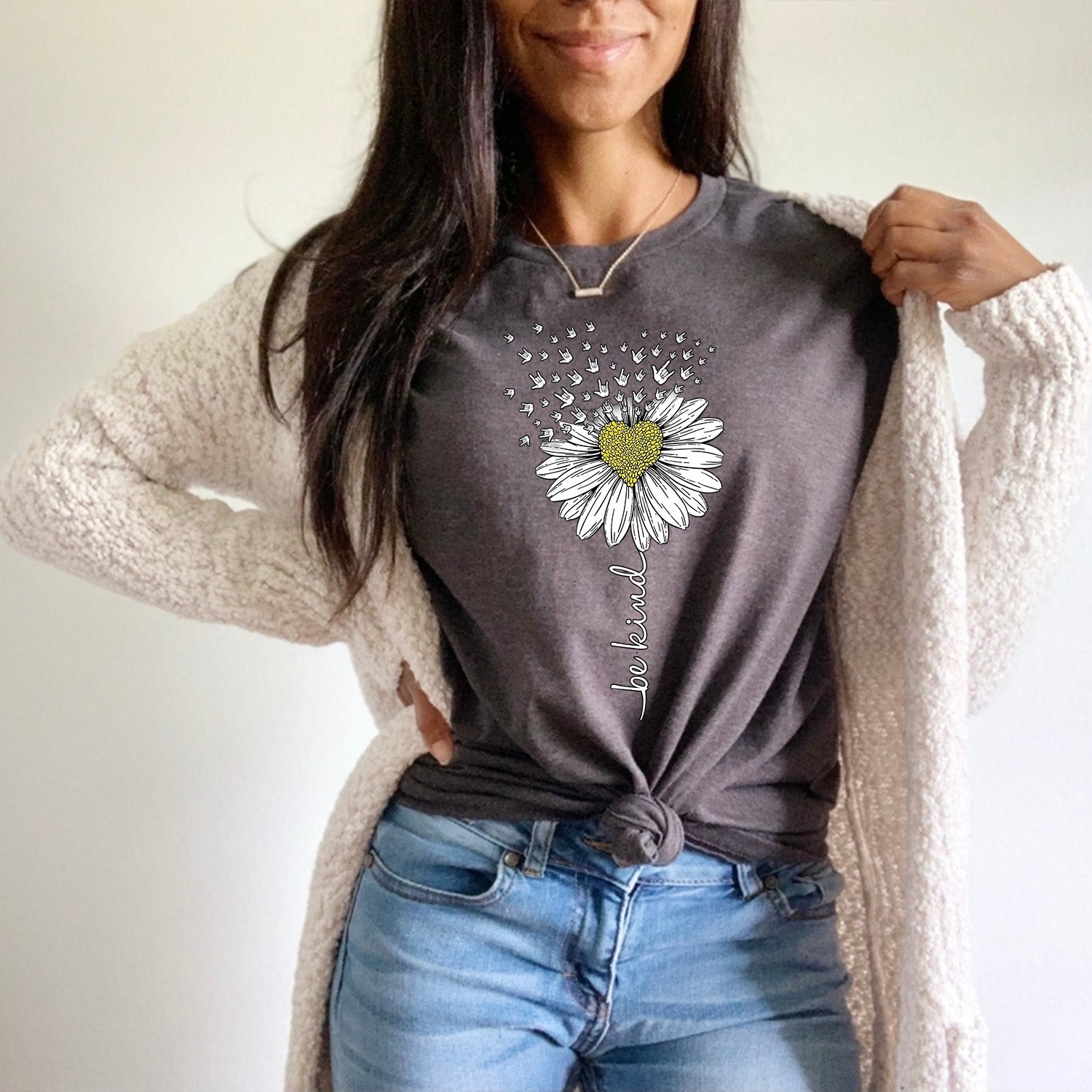 Be Kind Daisy Unisex T-shirt featuring a vibrant daisy graphic on a soft fabric, perfect for promoting kindness.