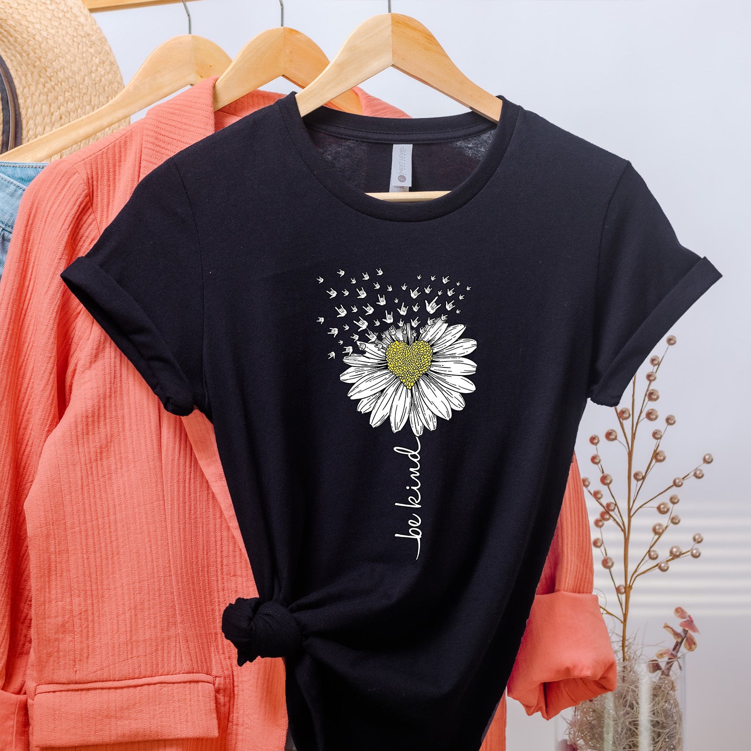 Be Kind Daisy Unisex T-shirt featuring a vibrant daisy graphic on a soft fabric, perfect for promoting kindness.