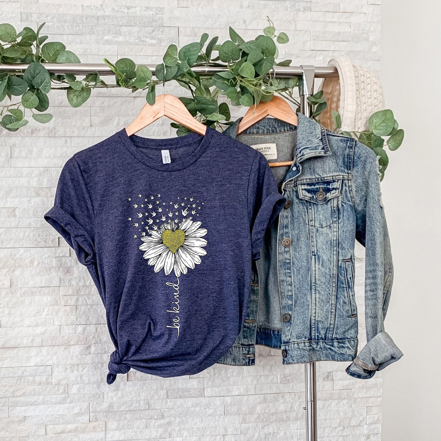 Be Kind Daisy Unisex T-shirt featuring a vibrant daisy graphic on a soft fabric, perfect for promoting kindness.