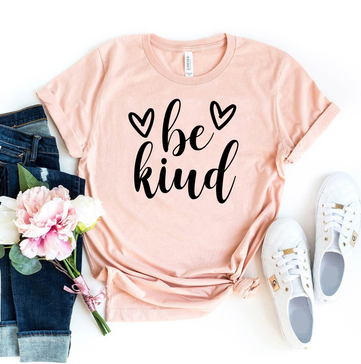 Be Kind T-shirt made of premium ring spun cotton, featuring a soft textile flex print design, available in various sizes.