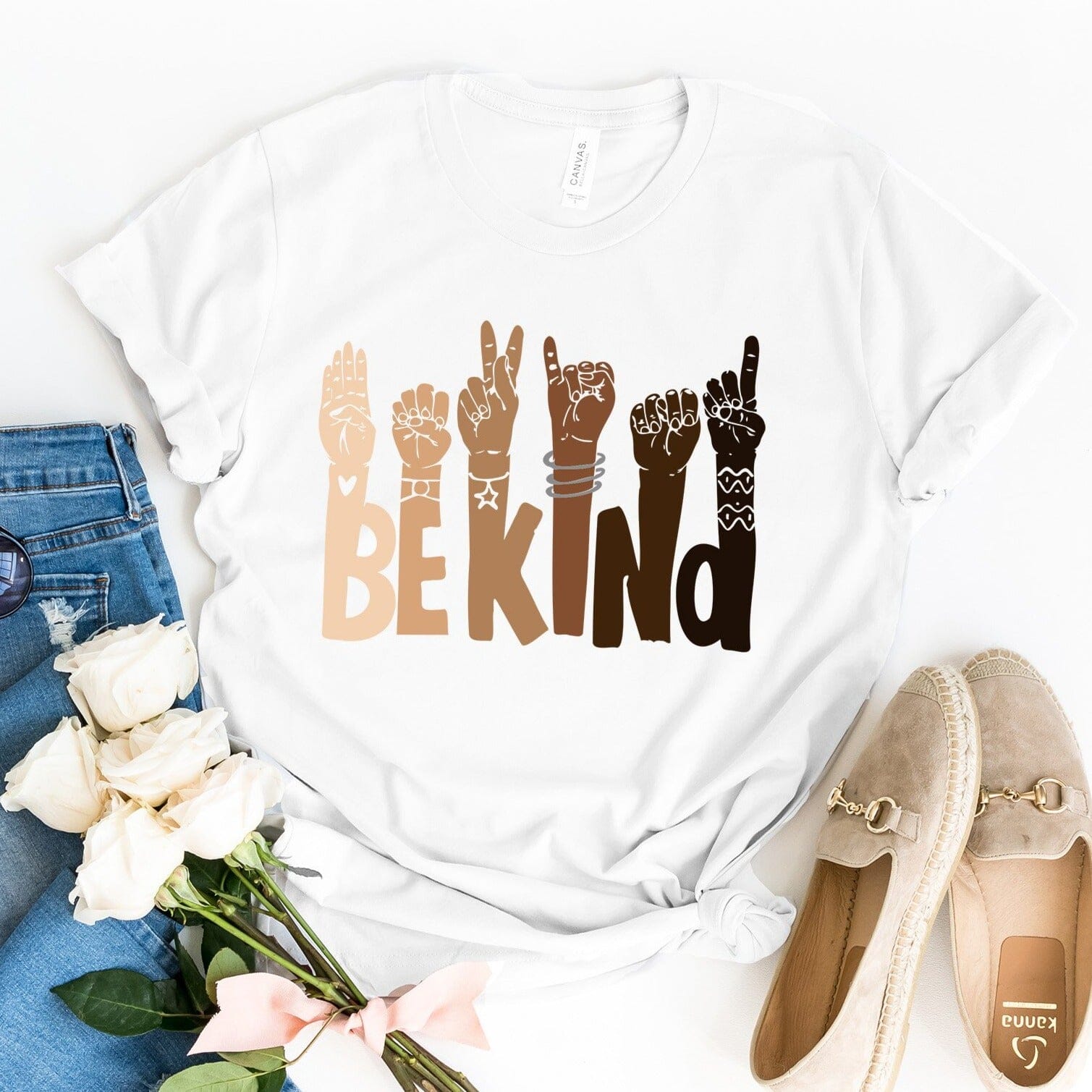 Be Kind T-shirt displayed on a mannequin, showcasing its soft fabric and unisex design in a vibrant color.