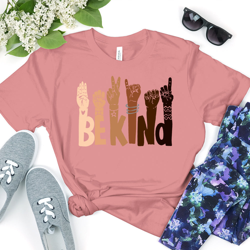 Be Kind T-shirt displayed on a mannequin, showcasing its soft fabric and unisex design in a vibrant color.