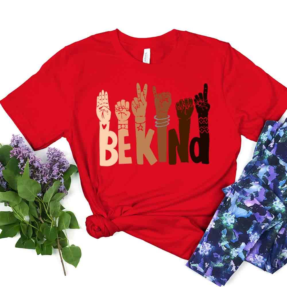 Be Kind T-shirt displayed on a mannequin, showcasing its soft fabric and unisex design in a vibrant color.