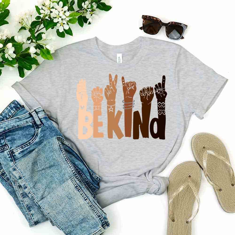 Be Kind T-shirt displayed on a mannequin, showcasing its soft fabric and unisex design in a vibrant color.