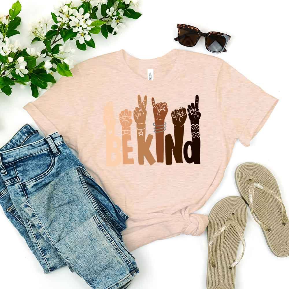 Be Kind T-shirt displayed on a mannequin, showcasing its soft fabric and unisex design in a vibrant color.