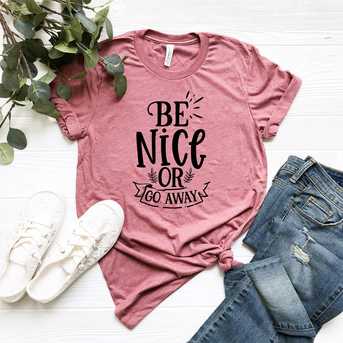 Be Nice Or Go Away Shirt in various colors, showcasing its soft fabric and stylish design.