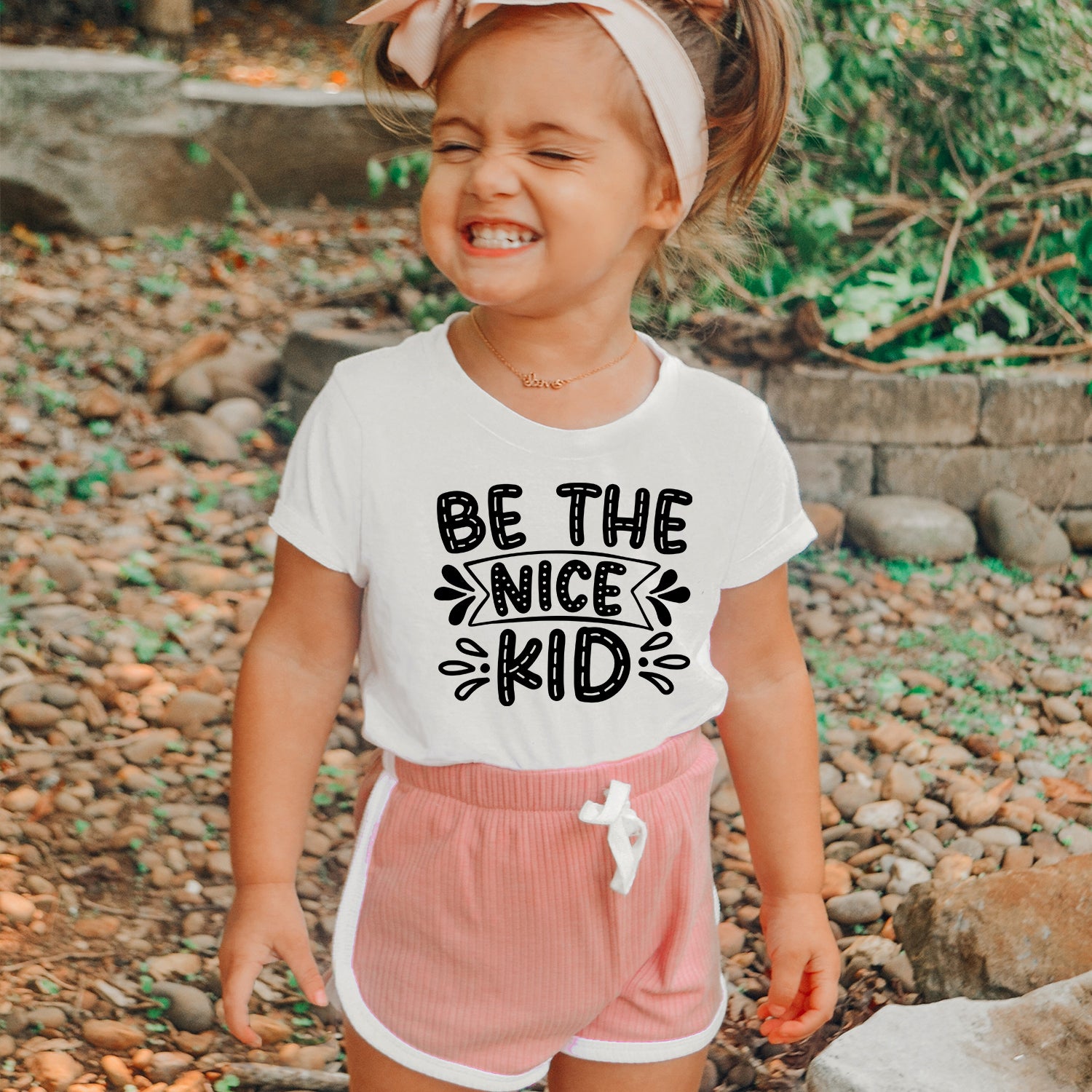 Be The Nice Kid Toddler T-shirt featuring a vibrant design, soft fabric, and comfortable fit, perfect for young children.