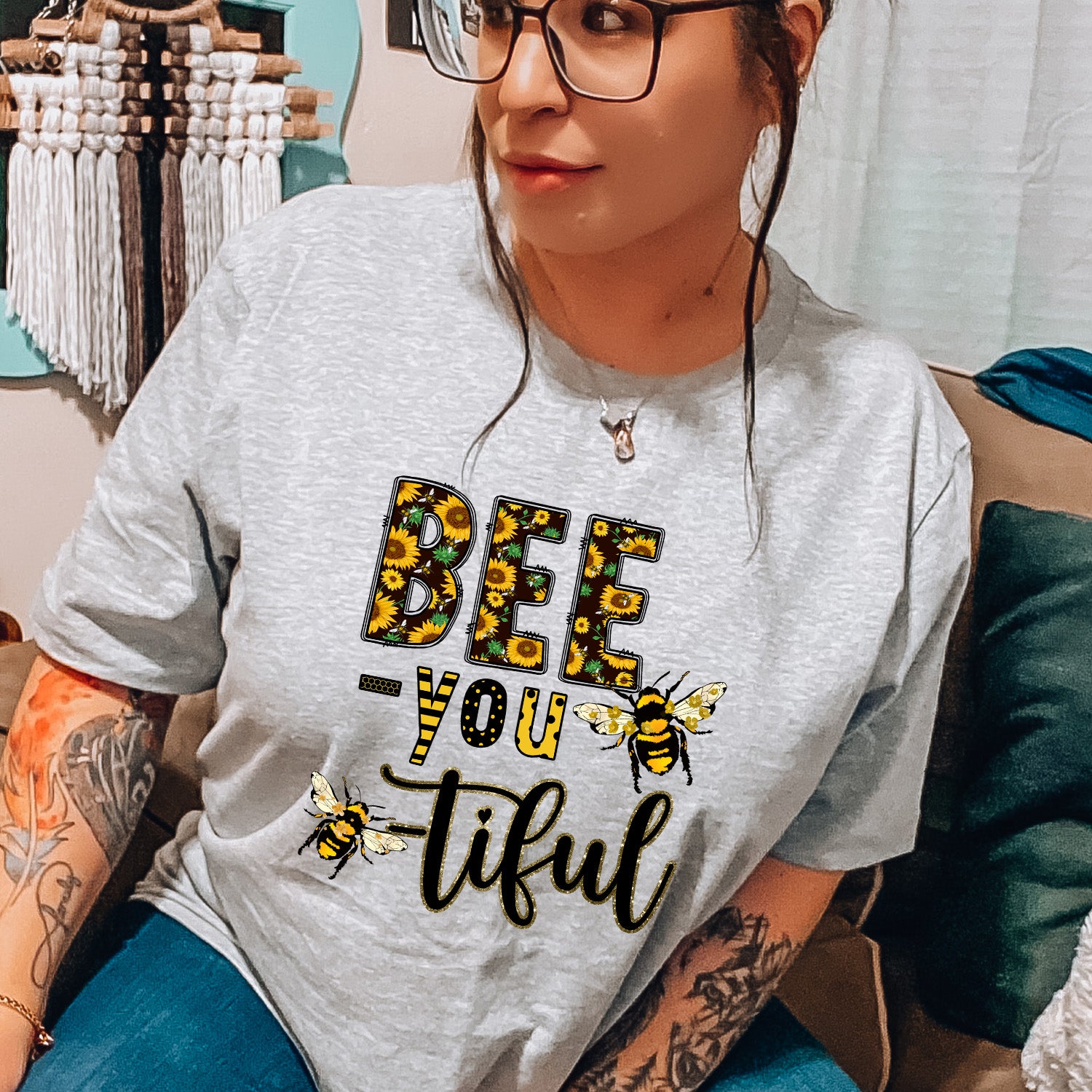 Bee You-tiful Sunflower Unisex T-shirt featuring a vibrant sunflower graphic on a soft fabric.