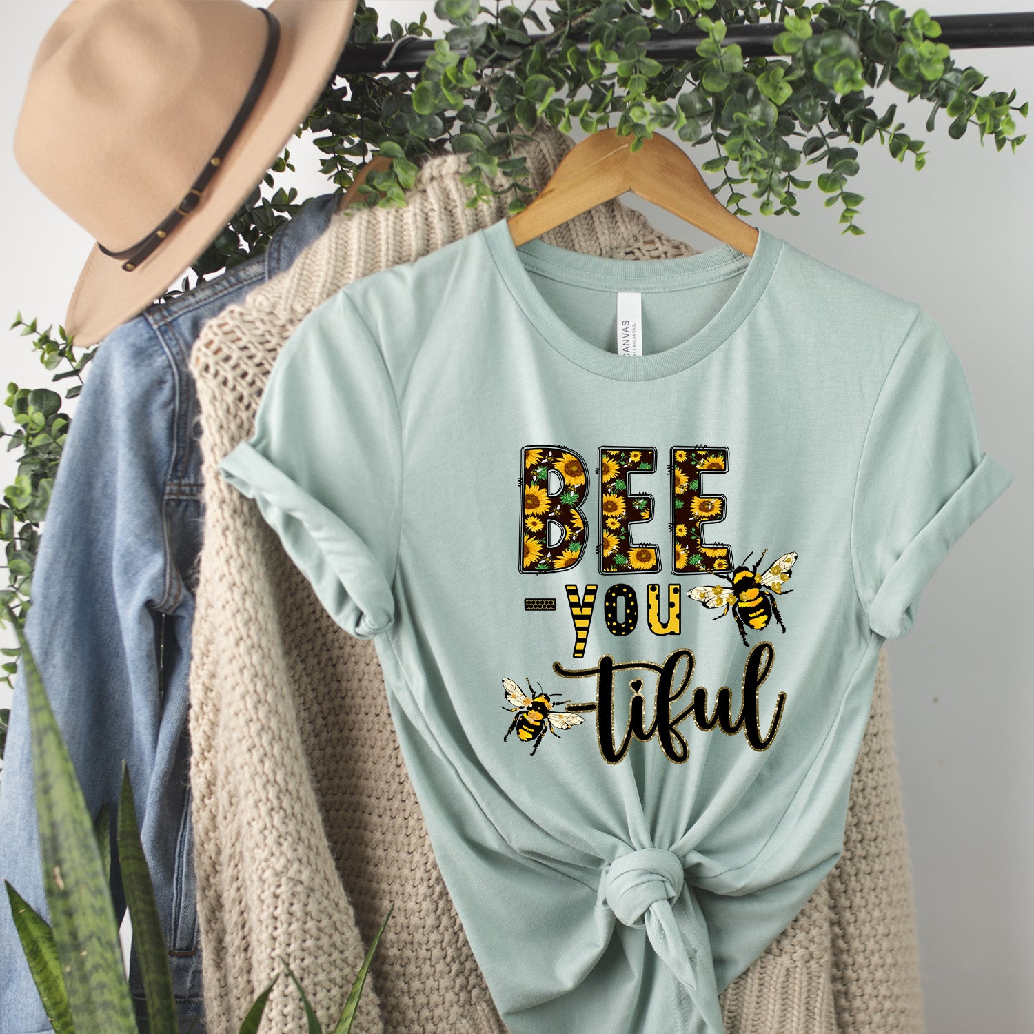 Bee You-tiful Sunflower Unisex T-shirt featuring a vibrant sunflower graphic on a soft fabric.