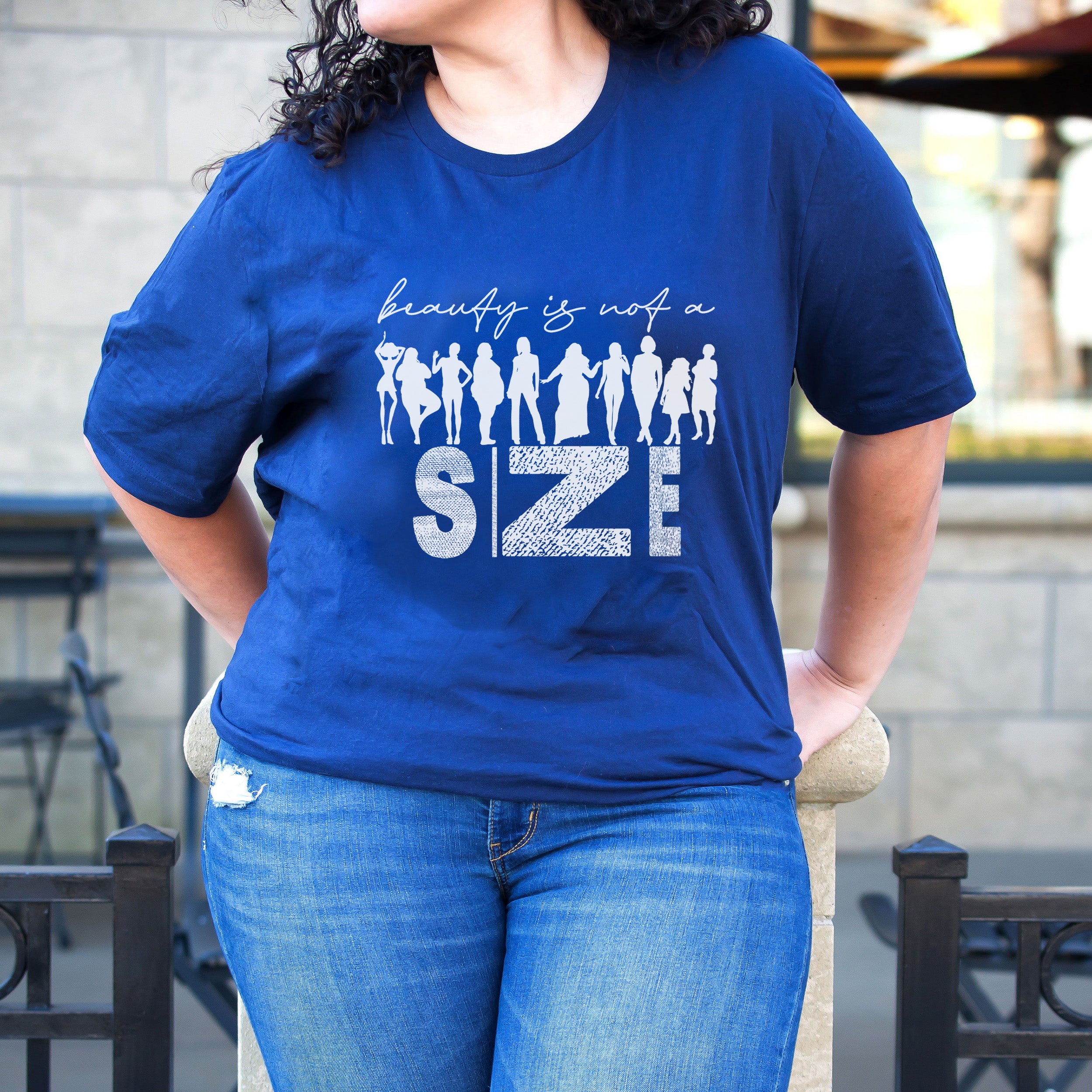 Beauty Is Not A Size Unisex T-shirt featuring a vibrant design promoting body positivity.