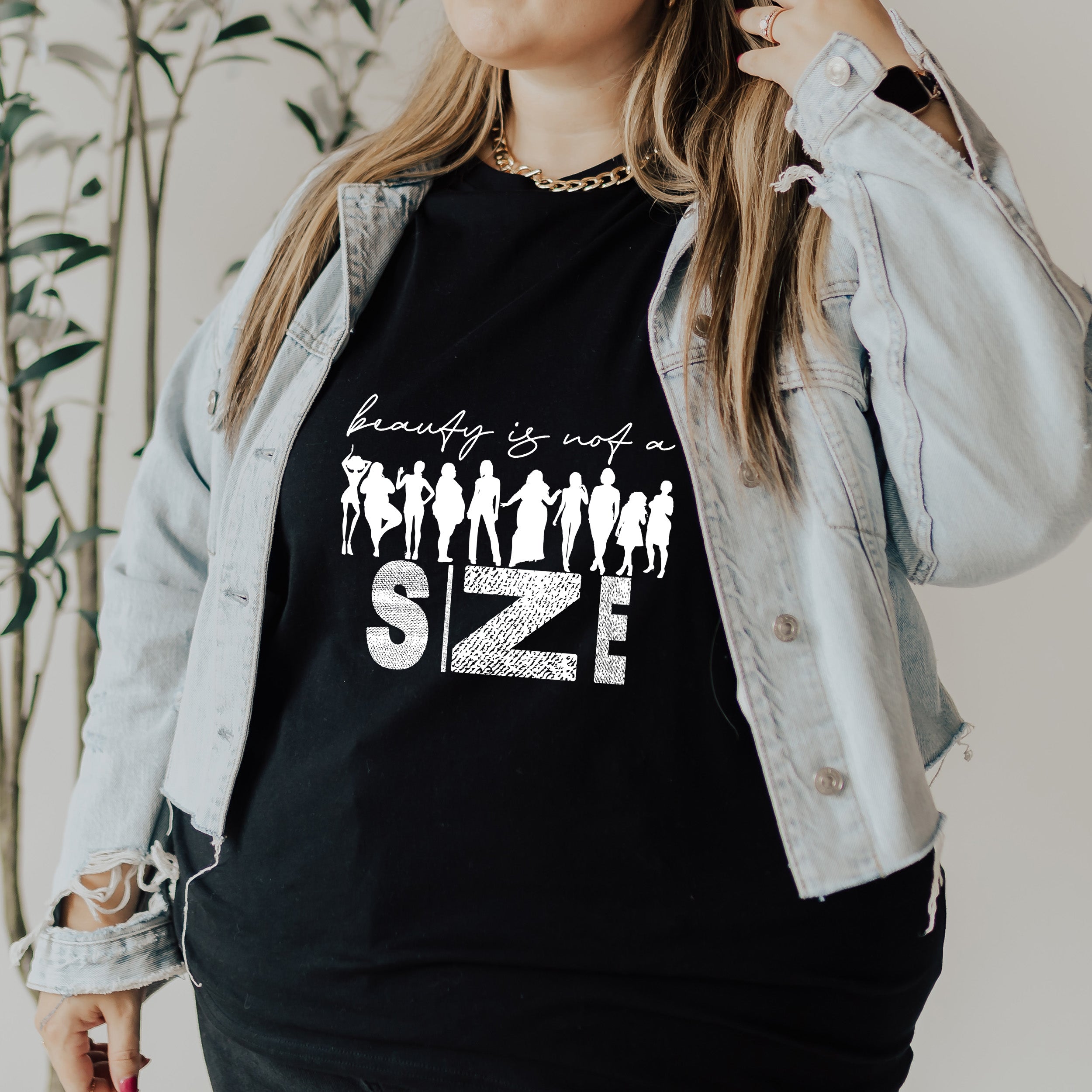 Beauty Is Not A Size Unisex T-shirt featuring a vibrant design promoting body positivity.