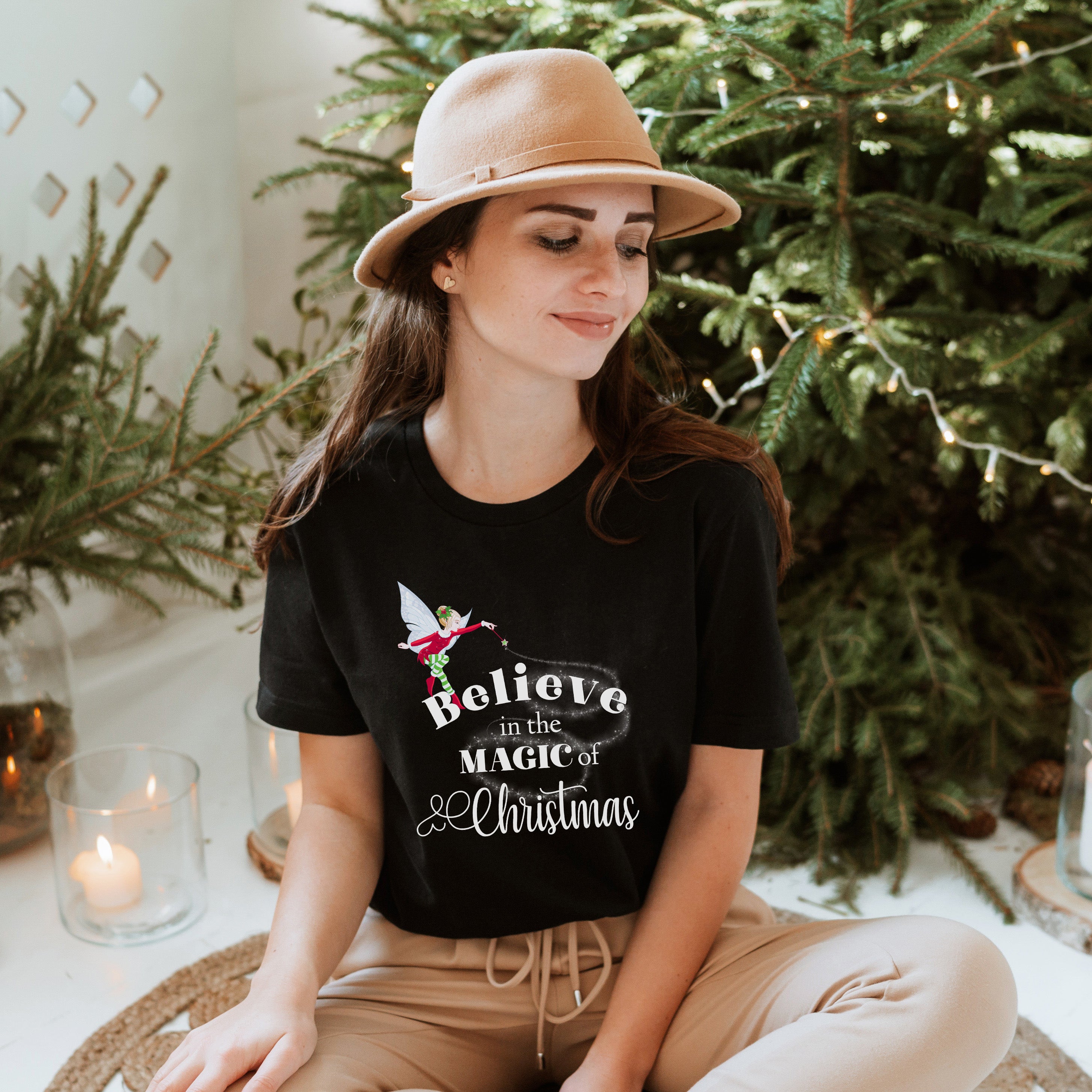 Believe In The Magic Of Christmas Unisex T-shirt featuring vibrant holiday-themed design, perfect for festive occasions.