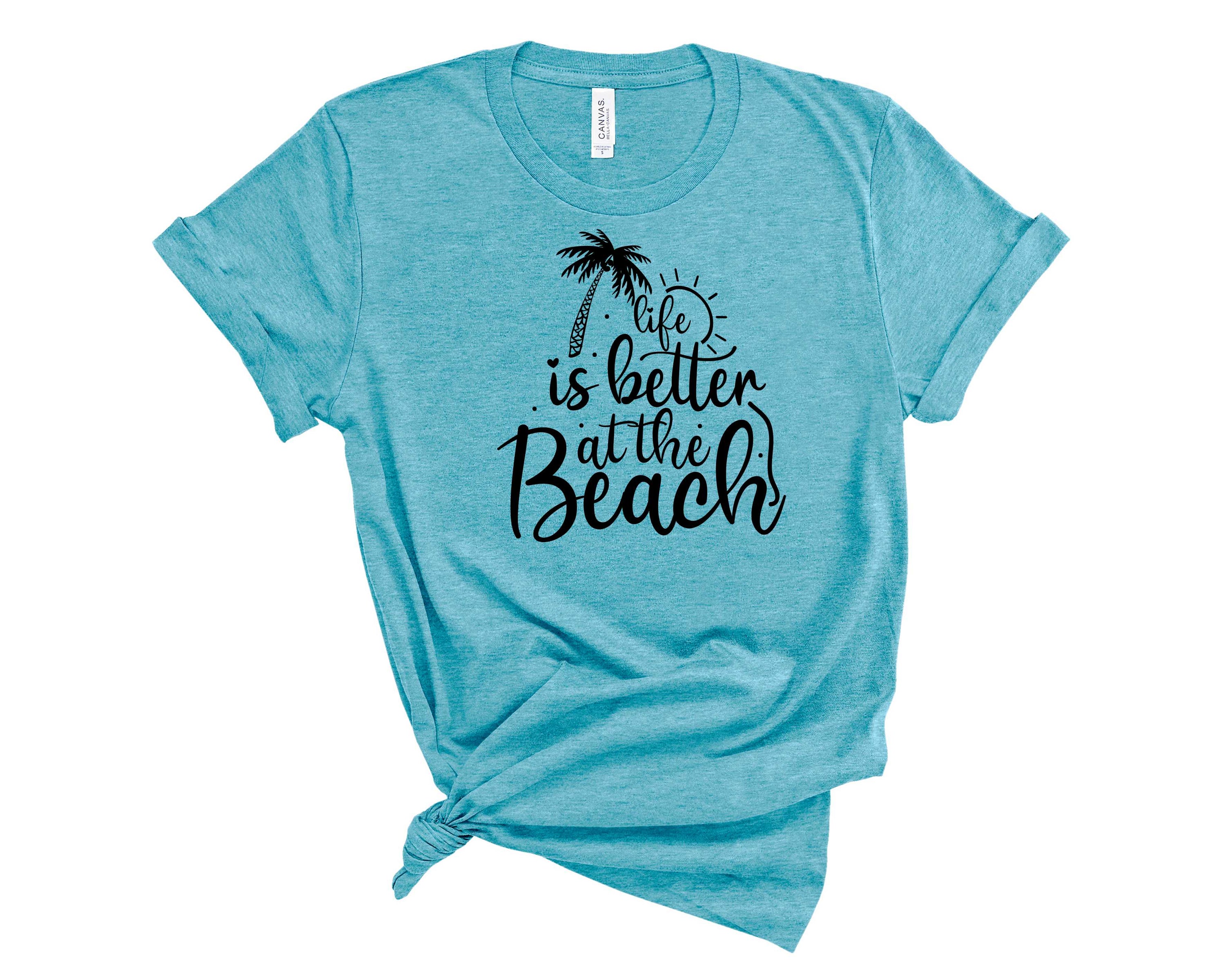 A unisex graphic tee featuring a vibrant beach design, perfect for summer outings.