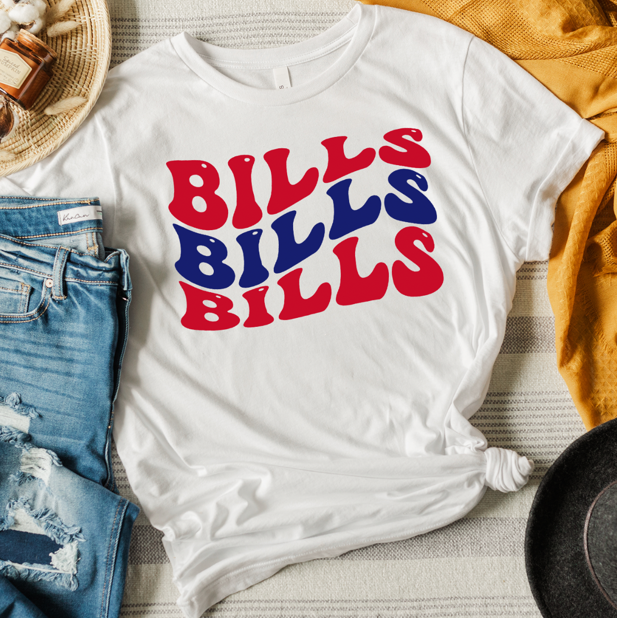 Bills Bills Bills Unisex T-shirt displayed on a neutral background, showcasing its vibrant graphic design and soft fabric.