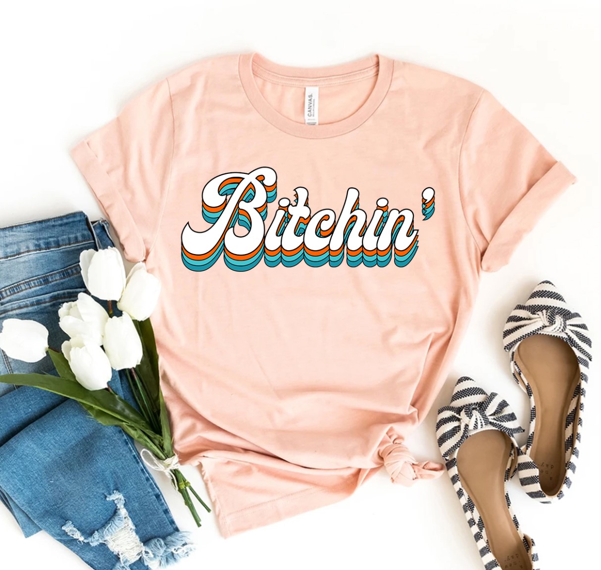 Bitchin T-shirt made of premium ring spun cotton with vibrant flex print design, available in various sizes.