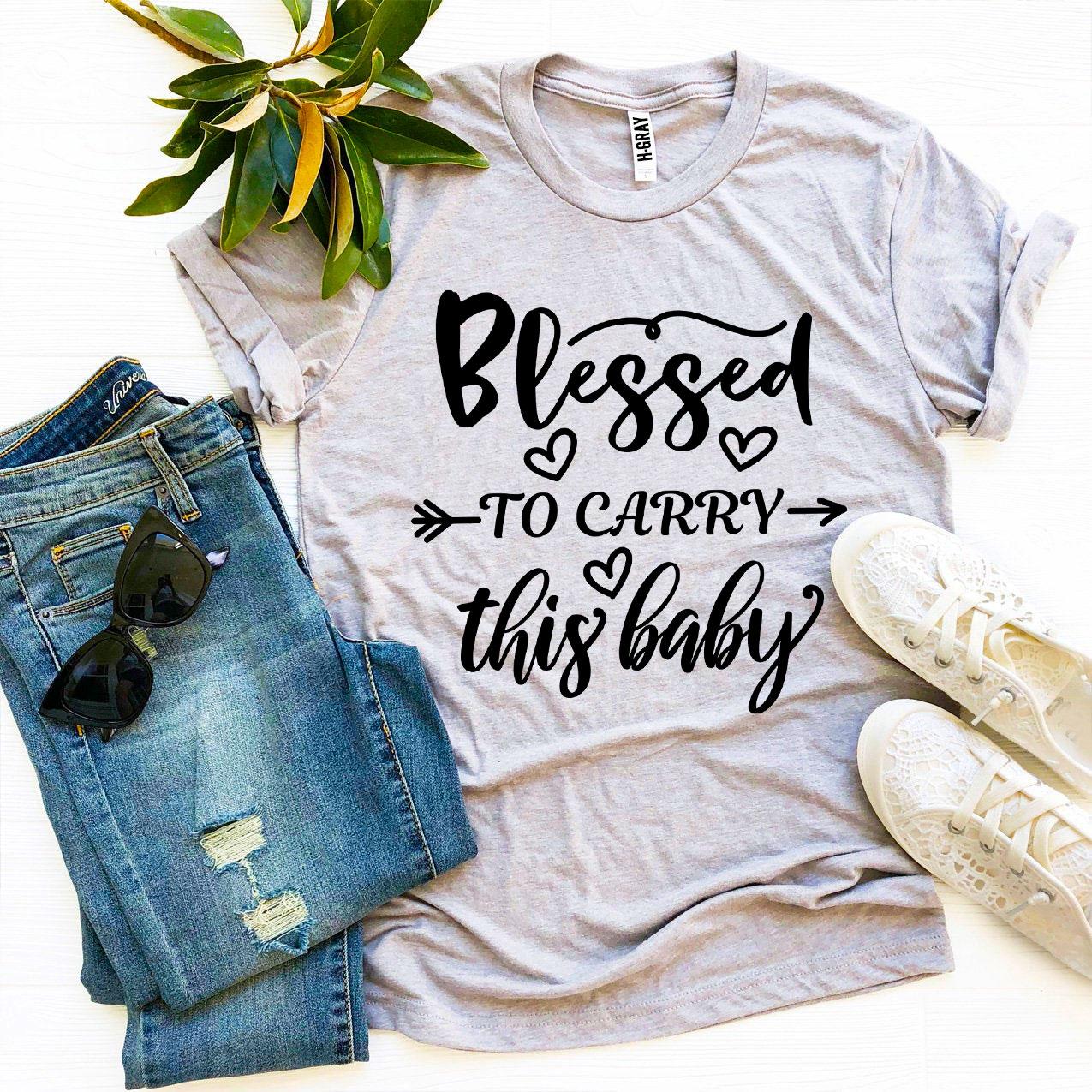 Blessed To Carry This Baby T-shirt made of soft ring spun cotton, featuring a high-quality flex print design.