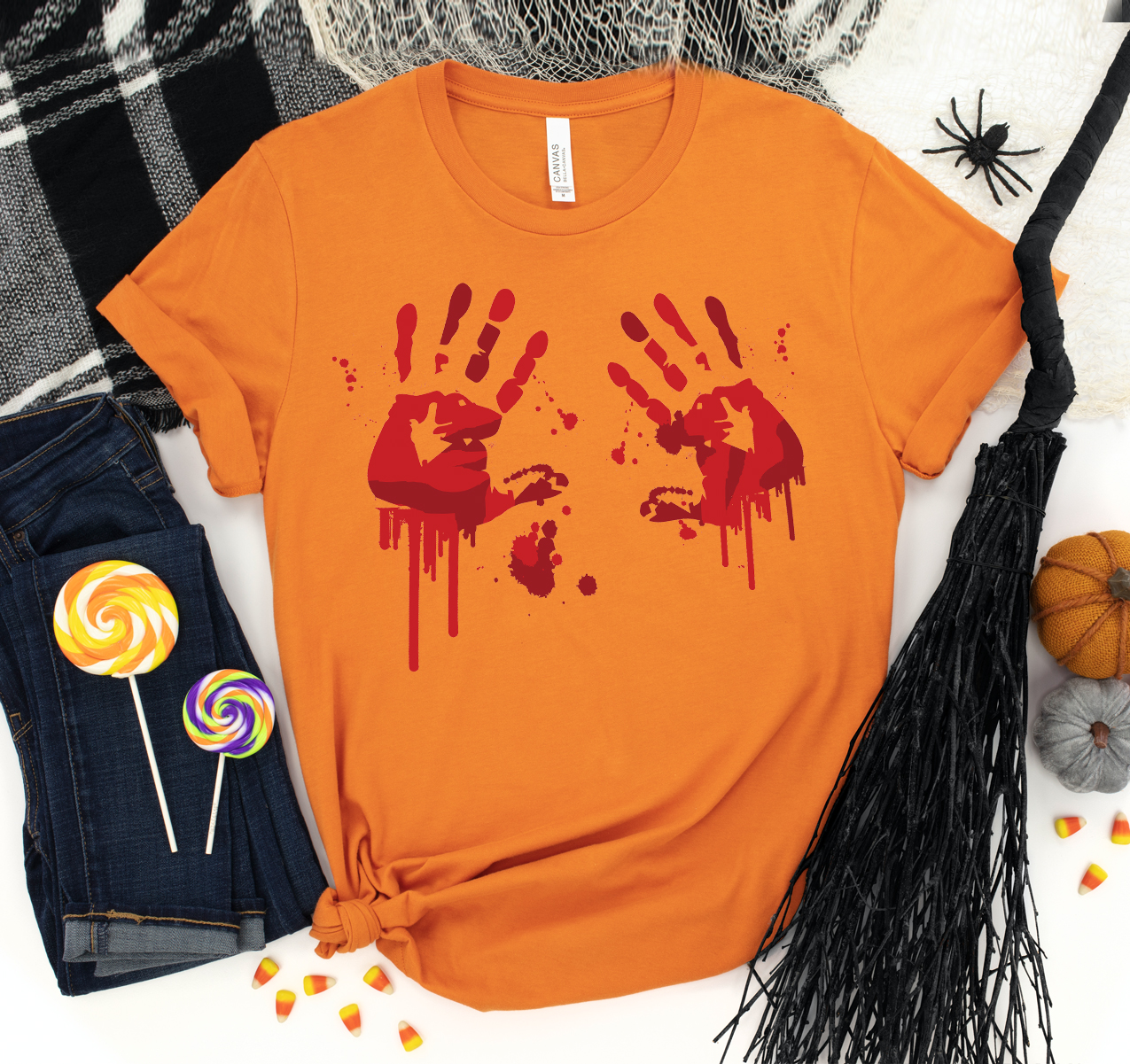 A unisex Bloody Hand Prints T-shirt featuring a unique bloody hand design on a soft cotton fabric.