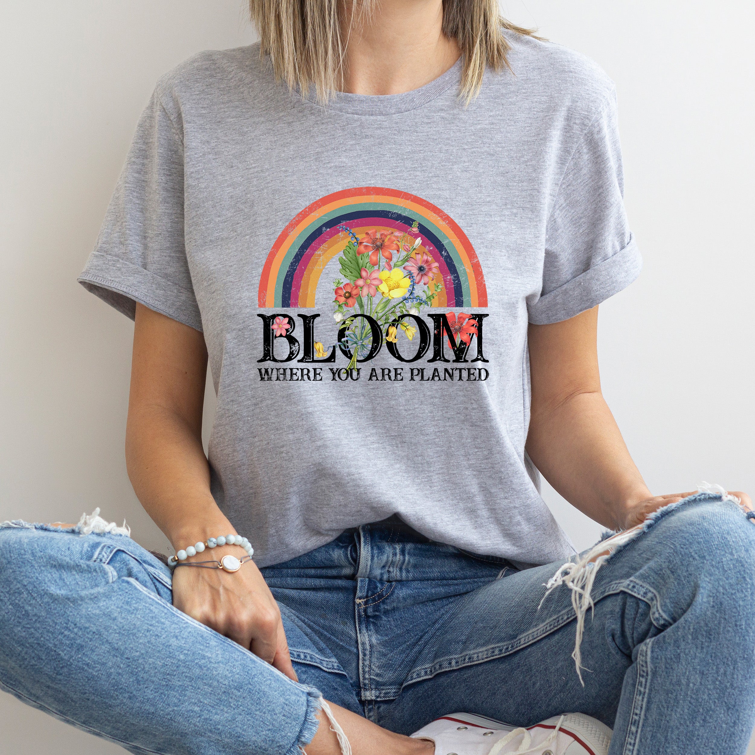 Bloom Where You Are Planted Unisex T-shirt featuring vibrant colors and inspirational text.