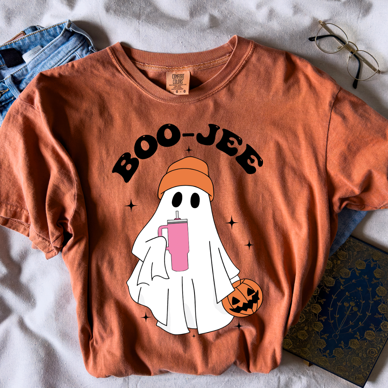 Boo-Jee Unisex T-shirt displayed on a neutral background, showcasing its vibrant design and soft fabric.