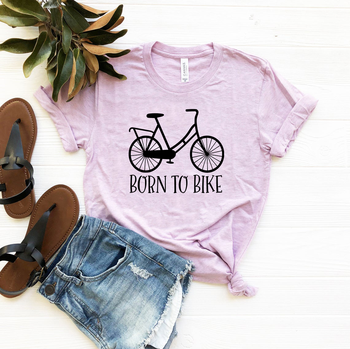 A comfortable unisex T-shirt featuring the phrase 'Born to Bike', made from soft ring spun cotton, available in multiple colors.