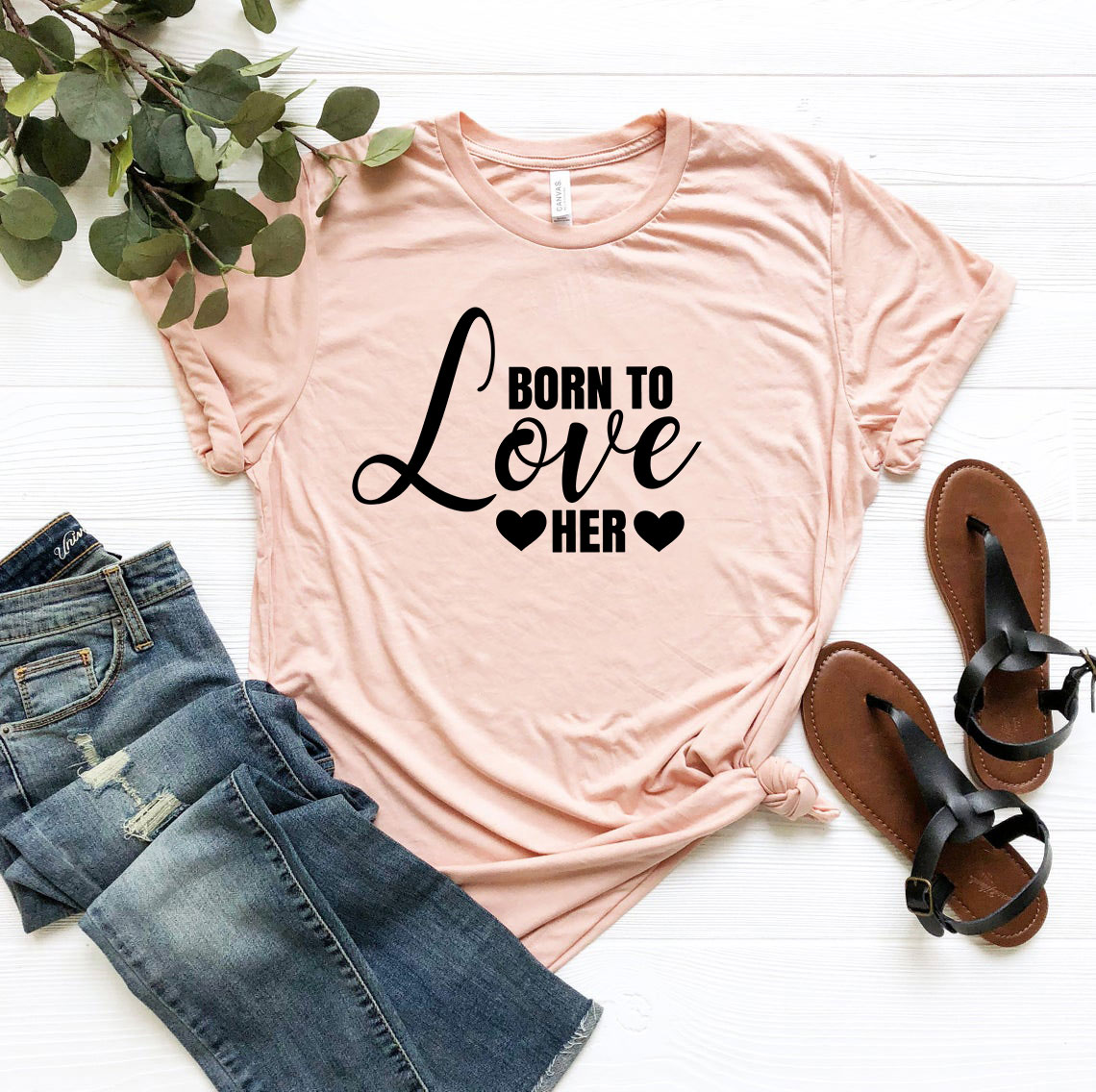 A stylish unisex T-shirt in various colors featuring the phrase 'Born to Love Her', made from soft ring spun cotton.