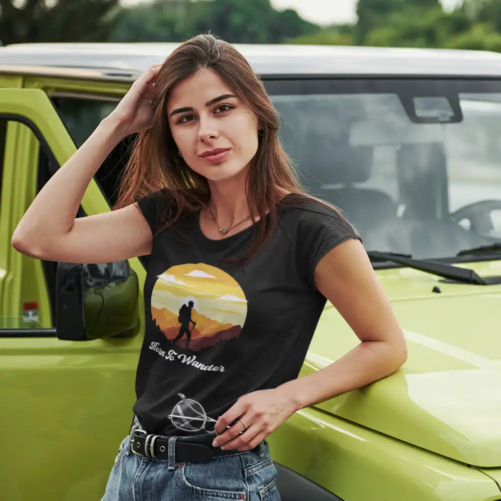 A stylish Born To Wander T-Shirt for Women, featuring a comfortable fit and unique design, perfect for casual outings and adventures.