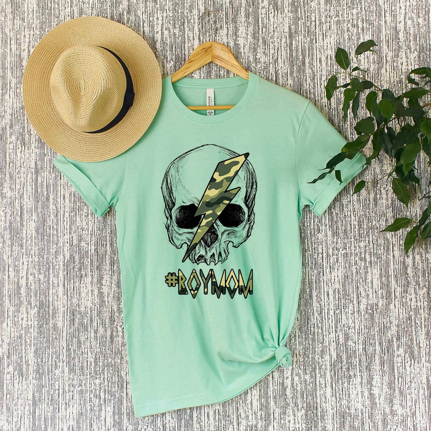 A stylish #BoyMom Skull Unisex T-shirt featuring a unique skull design, perfect for proud moms.