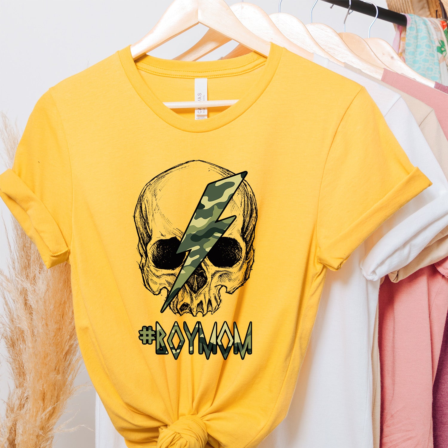 A stylish #BoyMom Skull Unisex T-shirt featuring a unique skull design, perfect for proud moms.