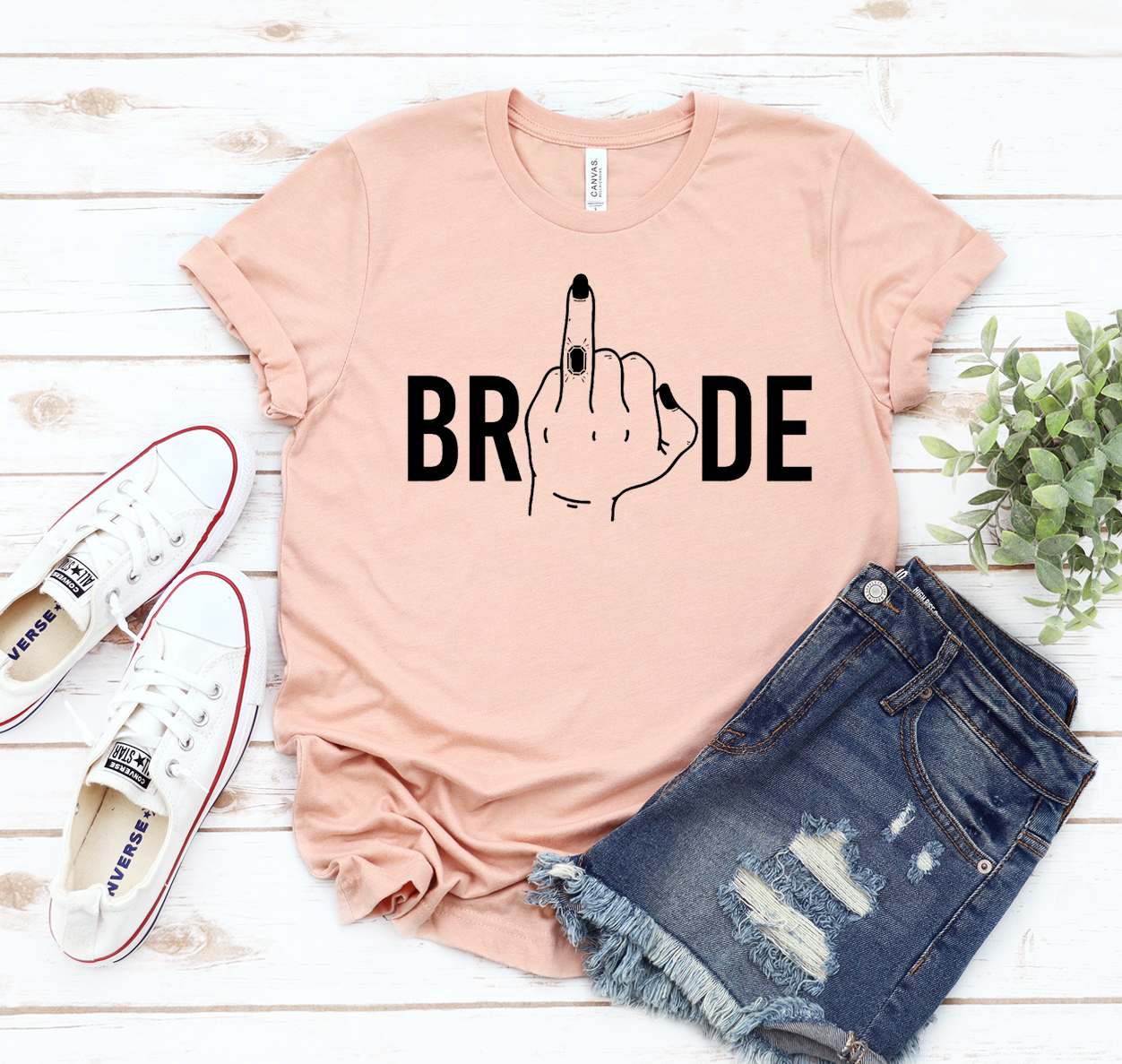 A stylish Bride T-shirt made from soft cotton, featuring a classic unisex design, perfect for bridal occasions.