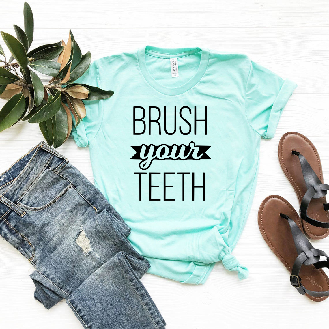 A comfortable unisex T-shirt featuring a fun 'Brush Your Teeth' print, available in multiple colors and sizes.