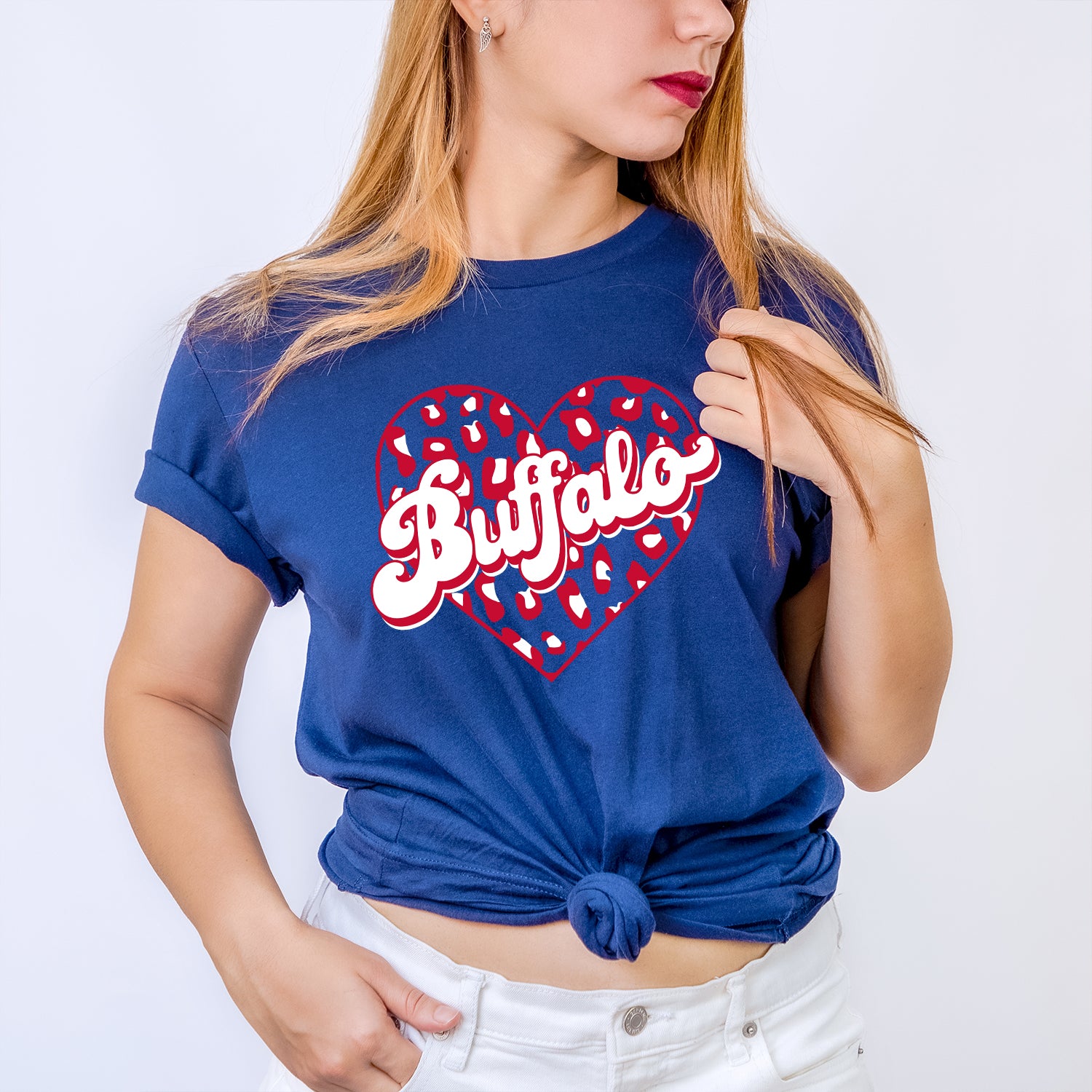 Buffalo Leopard Heart Unisex T-shirt featuring a vibrant leopard heart design on soft fabric.