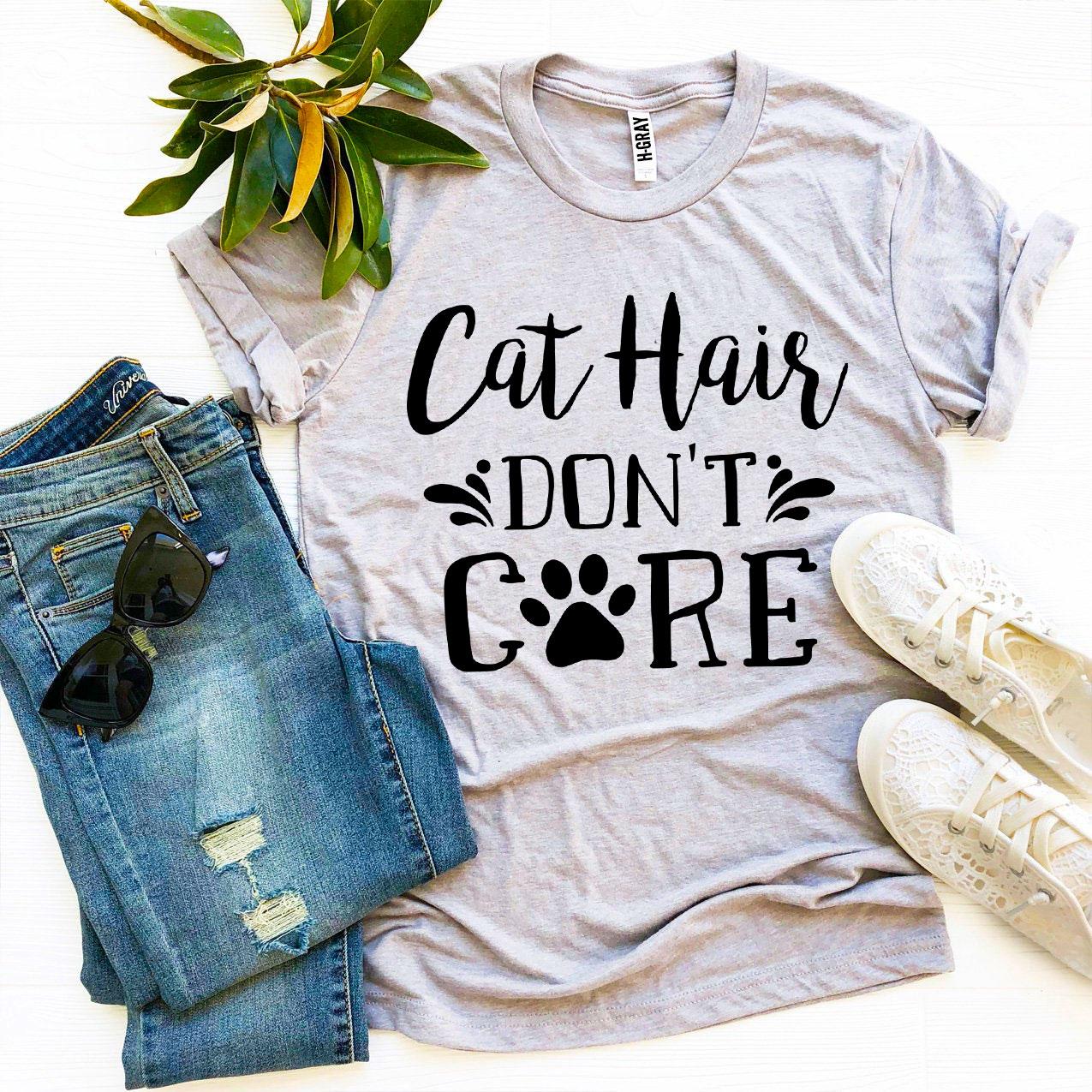 A stylish Cat Hair Don’t Care T-shirt made from premium ring spun cotton, featuring a humorous design perfect for cat lovers.