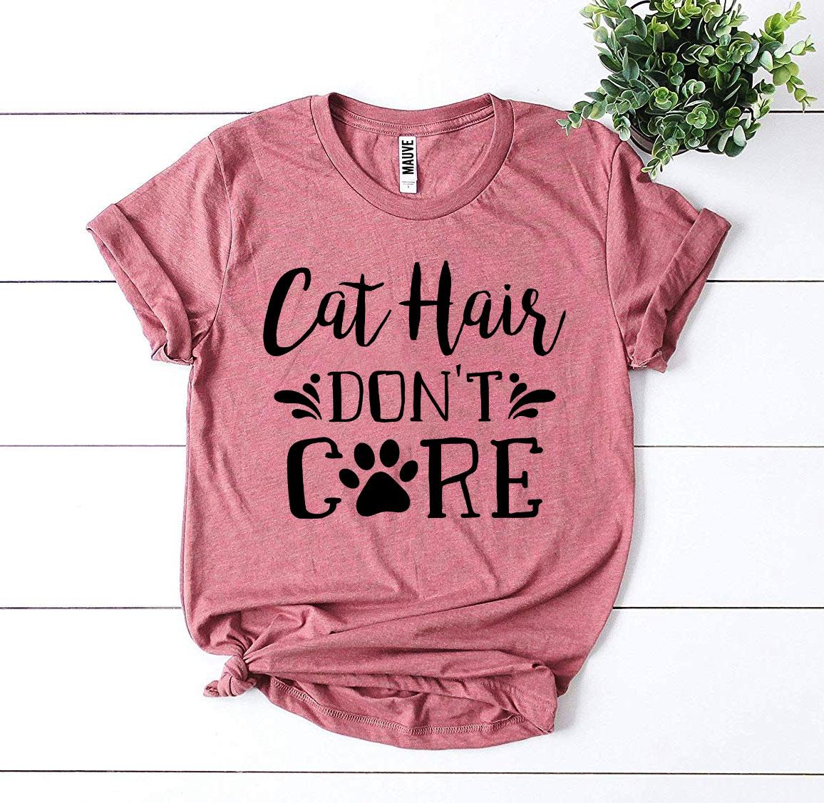 A stylish Cat Hair Don’t Care T-shirt made from premium ring spun cotton, featuring a humorous design perfect for cat lovers.