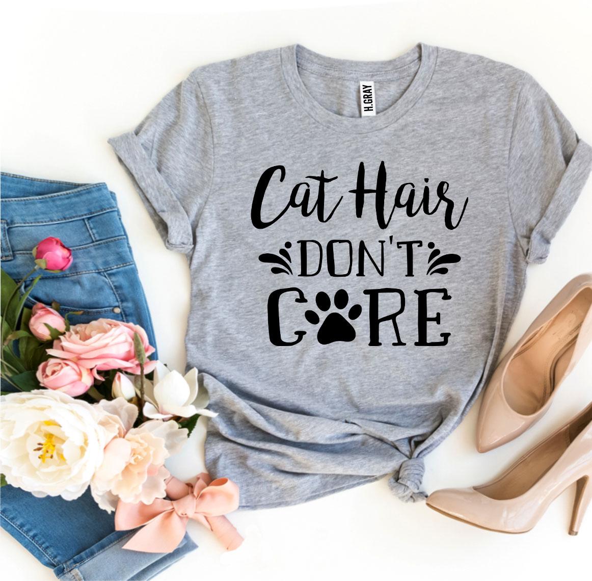 A stylish Cat Hair Don’t Care T-shirt made from premium ring spun cotton, featuring a humorous design perfect for cat lovers.