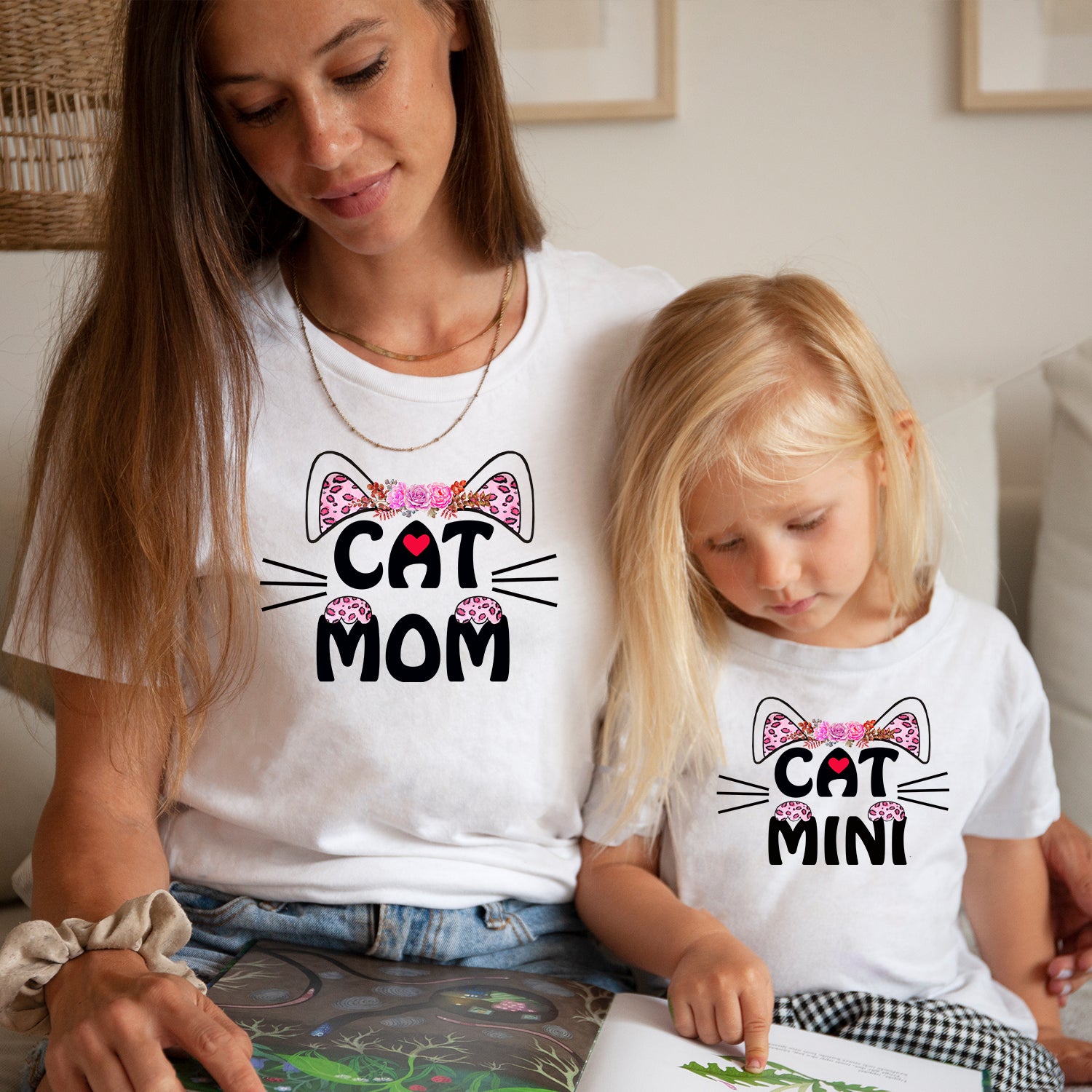 A stylish Cat Mom and Mini T-shirt featuring a cute cat graphic, perfect for cat lovers.