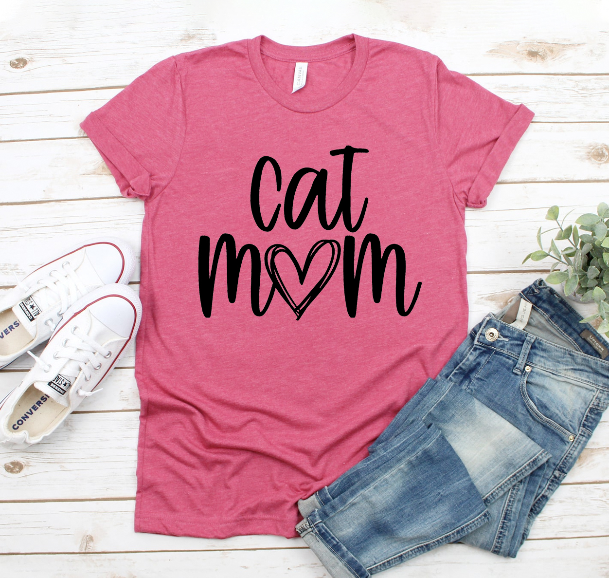 A stylish Cat Mom T-shirt made from soft, high-quality cotton, featuring a unisex design suitable for all cat lovers.