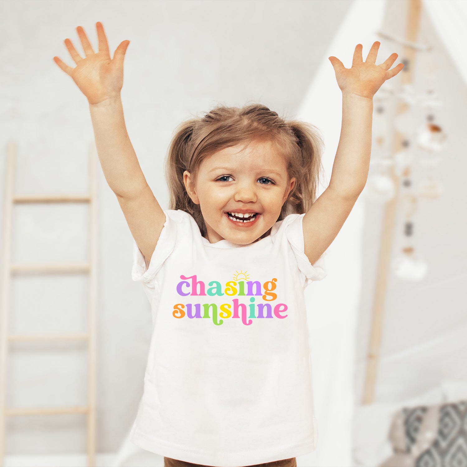 Chasing Sunshine Toddler T-shirt featuring vibrant colors and playful design, perfect for active toddlers.