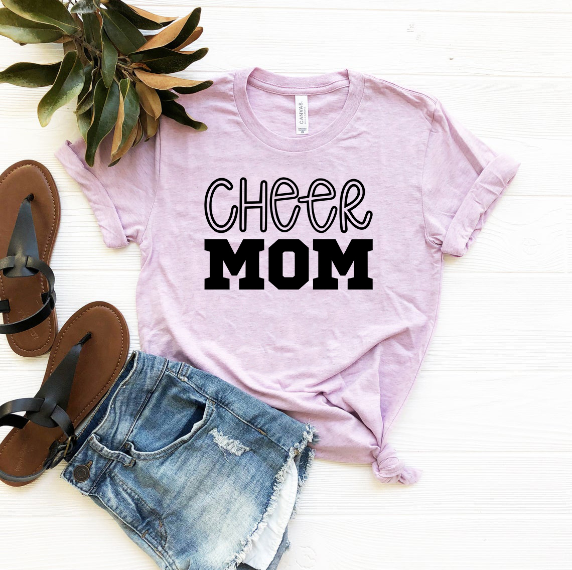 A stylish unisex Cheer Mom Shirt made from soft ring spun cotton, available in multiple colors and sizes.