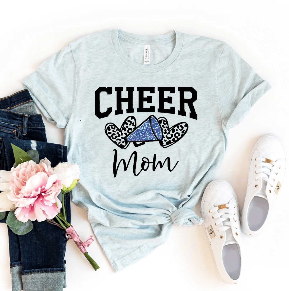 Cheer Mom T-shirt made of premium ring spun cotton, featuring a vibrant flex print design, available in various sizes.