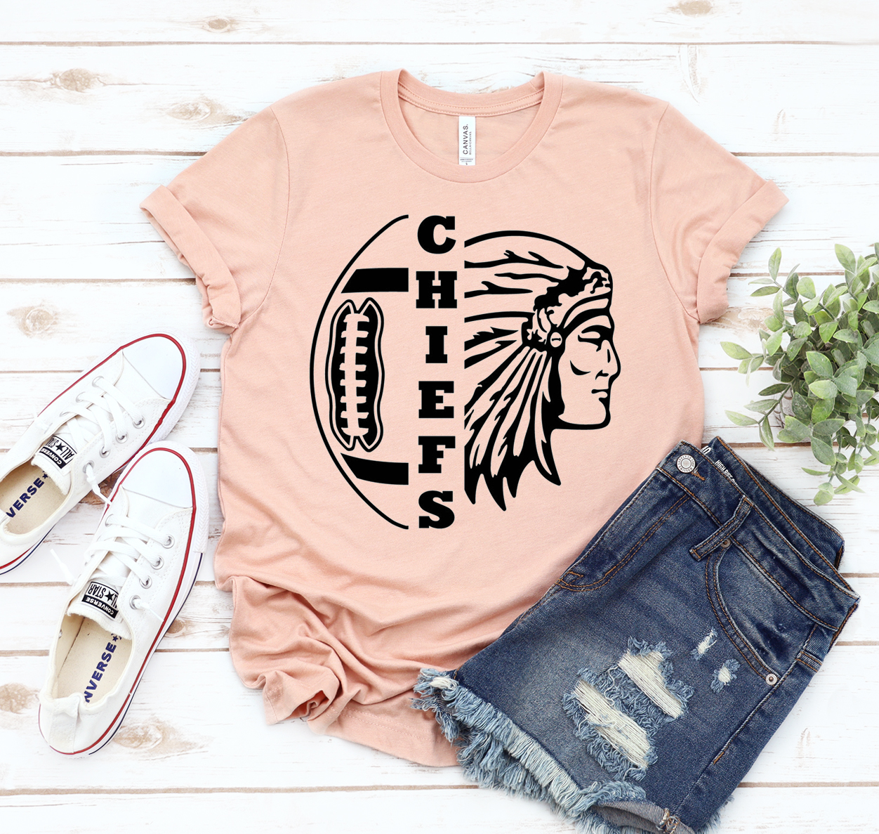 A classic unisex Chiefs Football T-shirt made from soft cotton, featuring the team's logo and available in various sizes.