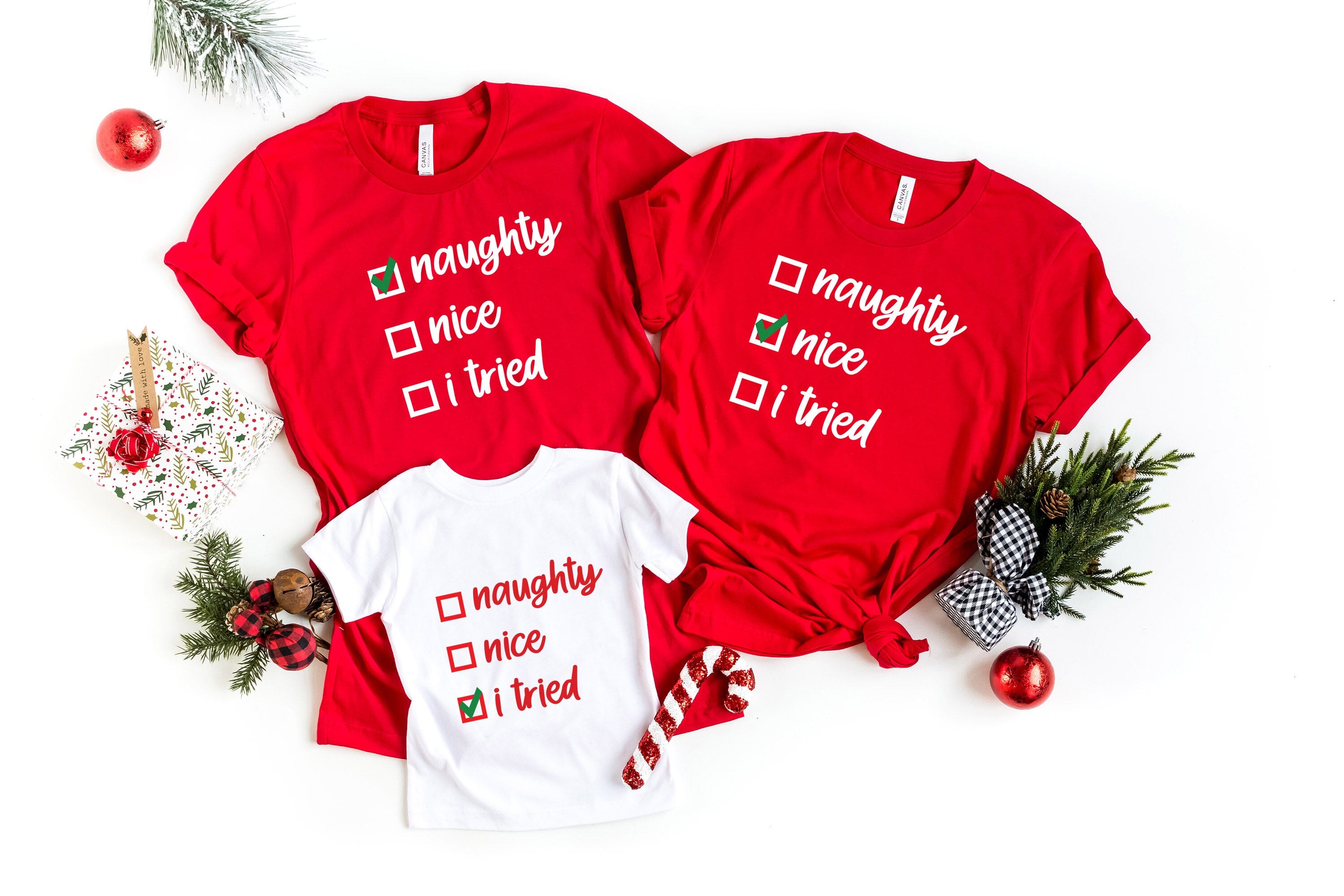 A festive Christmas Nice Checklist Tee featuring a humorous design, made from soft Ringspun Cotton, perfect for holiday celebrations.