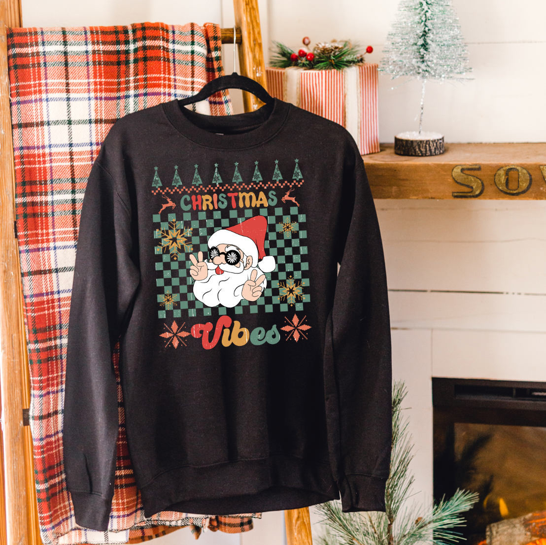 A cozy Christmas Vibes Ugly Sweatshirt featuring festive designs, perfect for holiday celebrations.