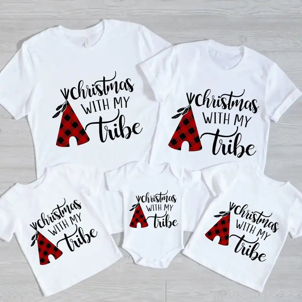 A family wearing matching Christmas With My Tribe Family Tees, showcasing festive designs and comfortable fit, perfect for holiday gatherings.